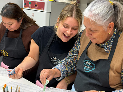Women enjoying a hands-on crafting activity.